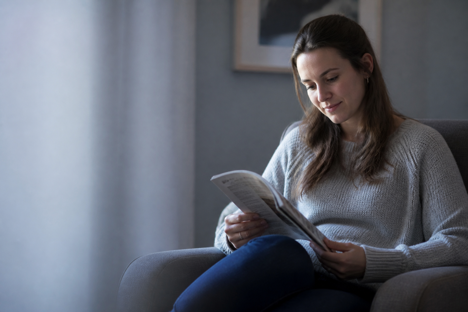 Pensive woman reading in calm daylight — not sad